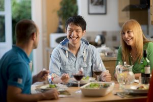 Executive student laughing with family