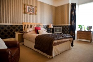 A double bed in a comfortable executive room.