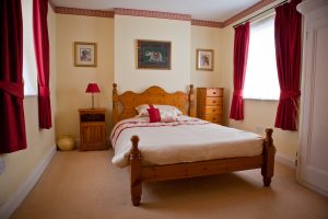 Spacious double bedroom in executive accommodation.
