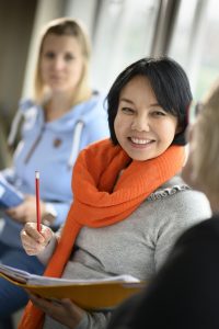 30+ student smiling and having fun in class