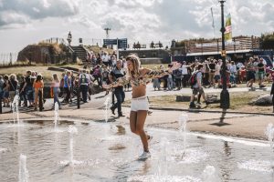 Woman dancing in the fountains of Southsea Castle