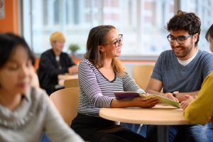 Students discussing English in Student lounge
