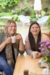 LSI/IH Portsmouth student drinking coffee with host mother.