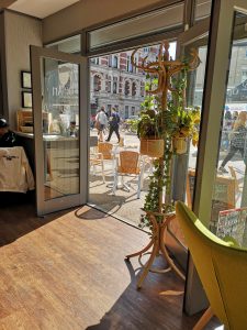 A view of the bustling street from the inside of 113