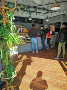 LSI/IH Portsmouth students wait for coffee and tea in 113.