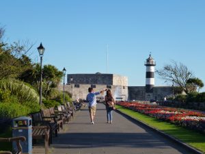 People walking to the Portsmouth lighthouse