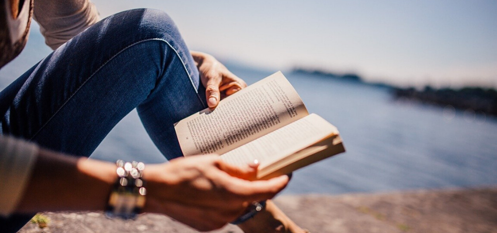 girl reading top ten books to learn english